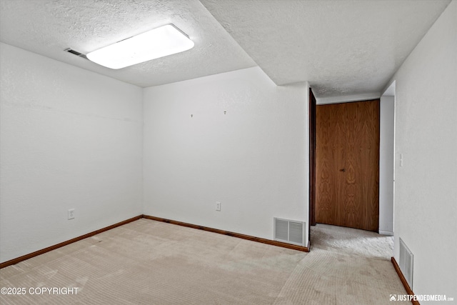 19712 Chugach Park Dr, Eagle River, AK 99567 - carpeted empty room with a textured ceiling and baseboards