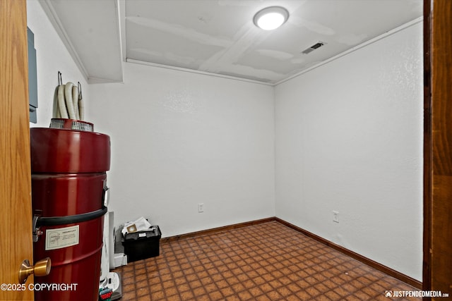 19712 Chugach Park Dr, Eagle River, AK 99567 - empty room with tile patterned floors and crown molding