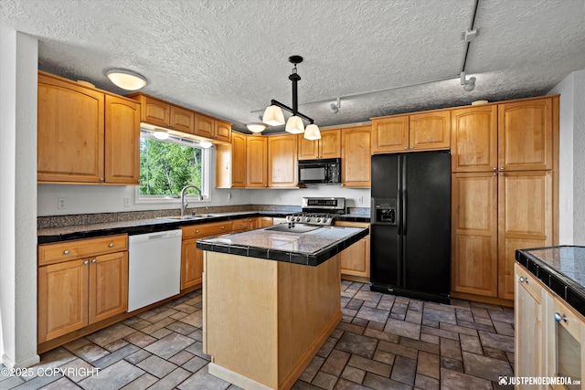 19712 Chugach Park Dr, Eagle River, AK 99567 - kitchen with black appliances, a center island, brick patterned floors, hanging light fixtures, and a textured ceiling