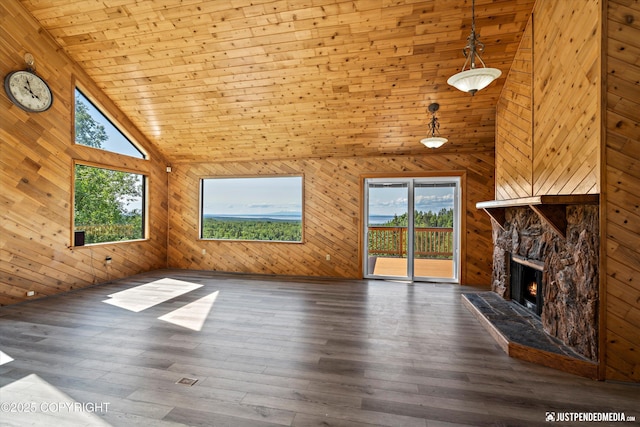 19712 Chugach Park Dr, Eagle River, AK 99567 - unfurnished living room with high vaulted ceiling, wooden walls, a stone fireplace, wood ceiling, and hardwood / wood-style flooring