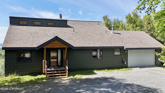19712 Chugach Park Dr, Eagle River, AK 99567 - view of front facade featuring roof with shingles, driveway, and an attached garage