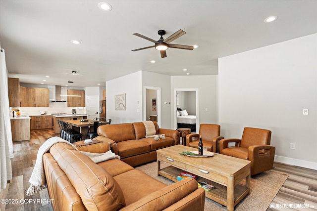 9203 Strutz Ave, Anchorage, AK 99507 - living area featuring ceiling fan, recessed lighting, and light wood-style flooring