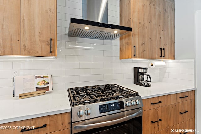 9203 Strutz Ave, Anchorage, AK 99507 - kitchen featuring gas stove, wall chimney range hood, decorative backsplash, and brown cabinetry