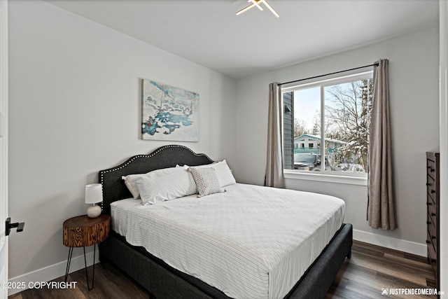 9203 Strutz Ave, Anchorage, AK 99507 - bedroom with dark wood-style flooring