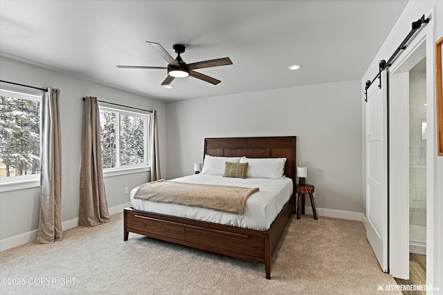 9203 Strutz Ave, Anchorage, AK 99507 - bedroom with a barn door, recessed lighting, light carpet, and ceiling fan