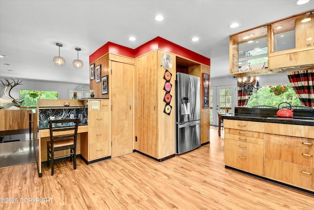 3890 Janet Lee Cir, Anchorage, AK 99516 - kitchen with stainless steel fridge, light wood finished floors, healthy amount of natural light, recessed lighting, and glass insert cabinets