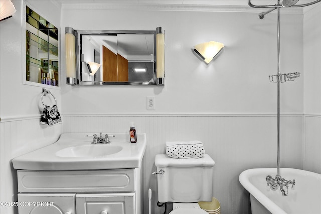 3890 Janet Lee Cir, Anchorage, AK 99516 - full bathroom with a freestanding bath, wainscoting, vanity, and crown molding