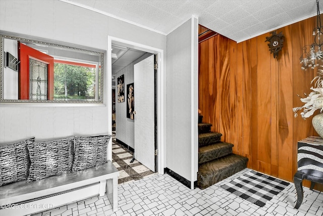 3890 Janet Lee Cir, Anchorage, AK 99516 - staircase with wood walls, crown molding, and tile patterned floors