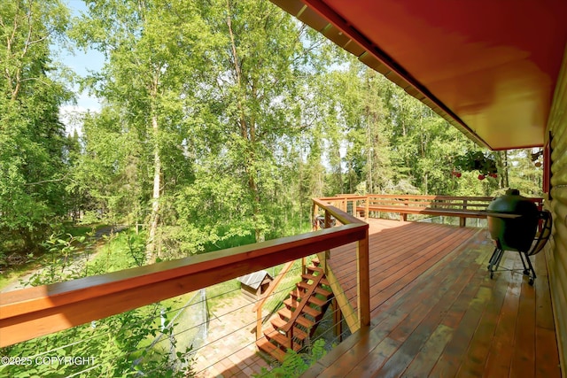3890 Janet Lee Cir, Anchorage, AK 99516 - wooden deck with a wooded view