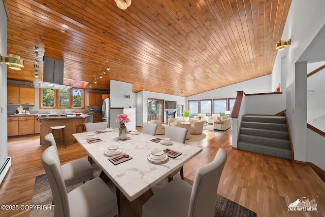 11411 Snowline Dr, Anchorage, AK 99507 - dining room featuring wooden ceiling, lofted ceiling, stairs, rail lighting, and light wood finished floors