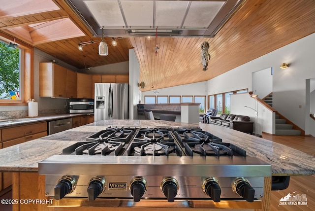 11411 Snowline Dr, Anchorage, AK 99507 - kitchen with stainless steel appliances, lofted ceiling, wood ceiling, brown cabinets, and open floor plan
