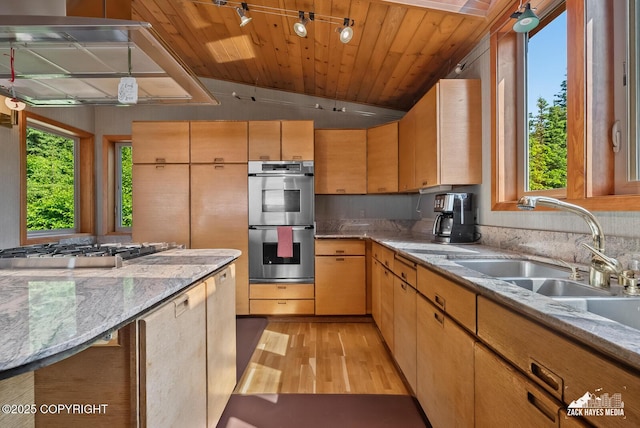 11411 Snowline Dr, Anchorage, AK 99507 - kitchen with stainless steel double oven, healthy amount of natural light, light wood finished floors, wooden ceiling, and light stone countertops