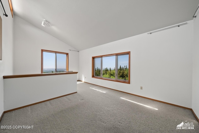 11411 Snowline Dr, Anchorage, AK 99507 - unfurnished room with vaulted ceiling and carpet flooring