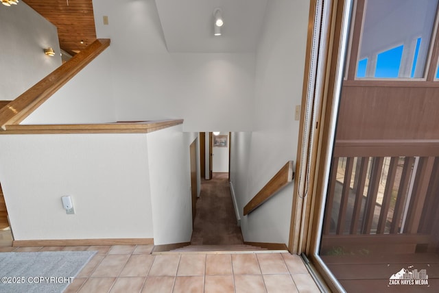 11411 Snowline Dr, Anchorage, AK 99507 - hall with stairs and tile patterned floors