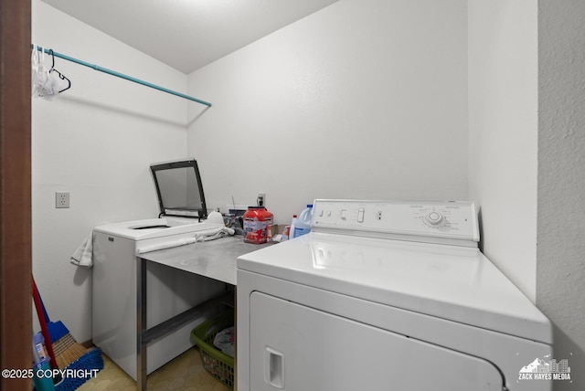 11411 Snowline Dr, Anchorage, AK 99507 - laundry room featuring washer / dryer