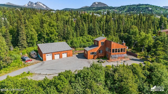 11411 Snowline Dr, Anchorage, AK 99507 - view from above of property featuring a heavily wooded area and a mountainous background