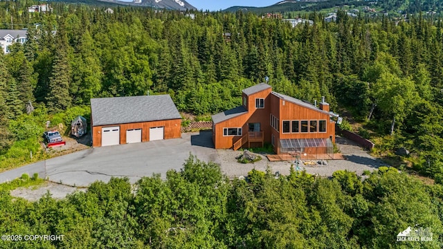 11411 Snowline Dr, Anchorage, AK 99507 - view from above of property featuring a heavily wooded area and a mountain backdrop