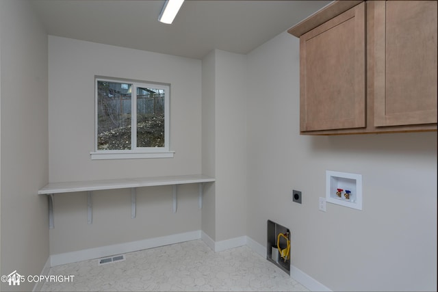 17939 Yellowstone Dr, Eagle River, AK 99577 - laundry room with cabinet space, hookup for an electric dryer, and washer hookup