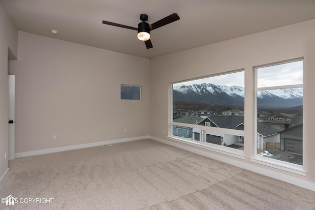 17939 Yellowstone Dr, Eagle River, AK 99577 - carpeted spare room featuring ceiling fan, plenty of natural light, and a smoke detector