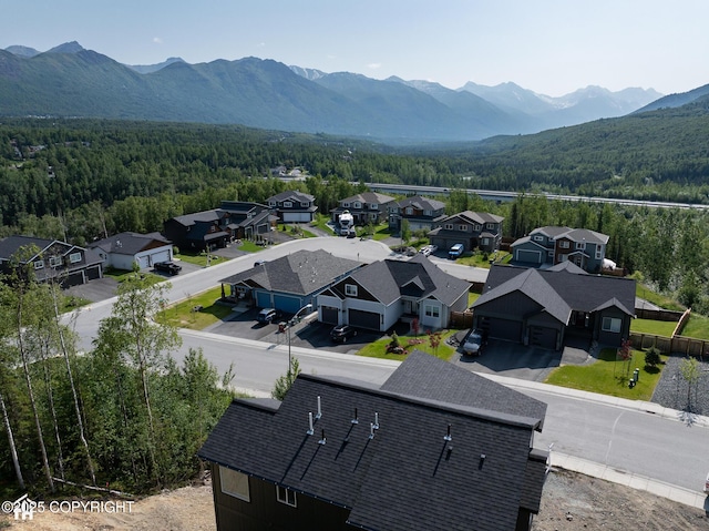 17939 Yellowstone Dr, Eagle River, AK 99577 - aerial view of residential area featuring a forest and a mountain backdrop