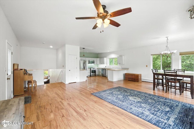 1447 N Ranch Rd, Palmer, AK 99645 - living room with ceiling fan, light wood-type flooring, a baseboard radiator, and recessed lighting