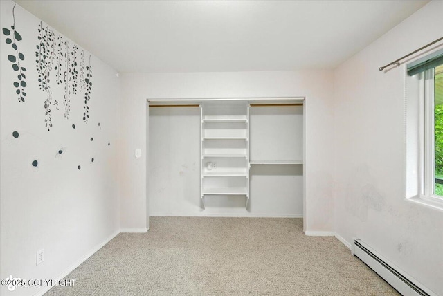 1447 N Ranch Rd, Palmer, AK 99645 - unfurnished bedroom with a baseboard radiator, carpet floors, multiple windows, and a closet