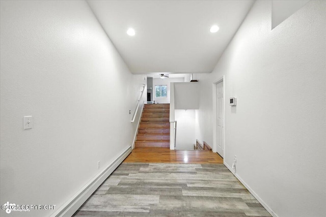 1447 N Ranch Rd, Palmer, AK 99645 - hallway with a baseboard radiator, wood finished floors, recessed lighting, and stairs