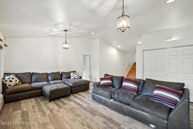 1447 N Ranch Rd, Palmer, AK 99645 - living room featuring lofted ceiling, light wood-type flooring, stairs, and recessed lighting