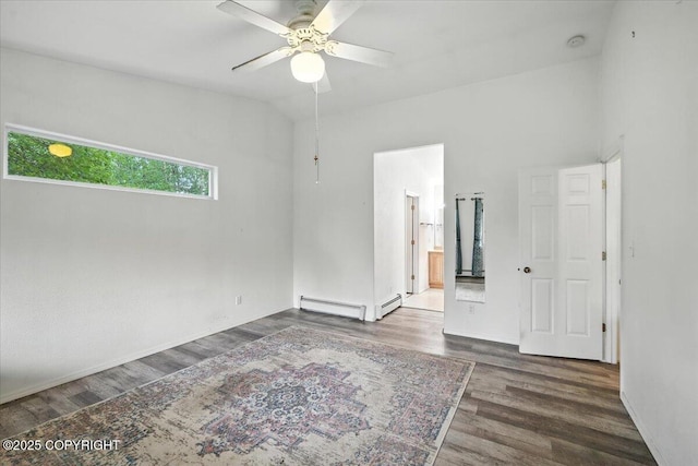 1447 N Ranch Rd, Palmer, AK 99645 - unfurnished bedroom with wood finished floors, vaulted ceiling, ceiling fan, a baseboard radiator, and ensuite bathroom