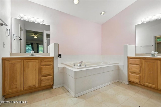 1447 N Ranch Rd, Palmer, AK 99645 - bathroom with two vanities, a bath, a ceiling fan, and recessed lighting