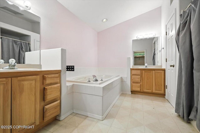 1447 N Ranch Rd, Palmer, AK 99645 - bathroom with two vanities, a garden tub, and vaulted ceiling