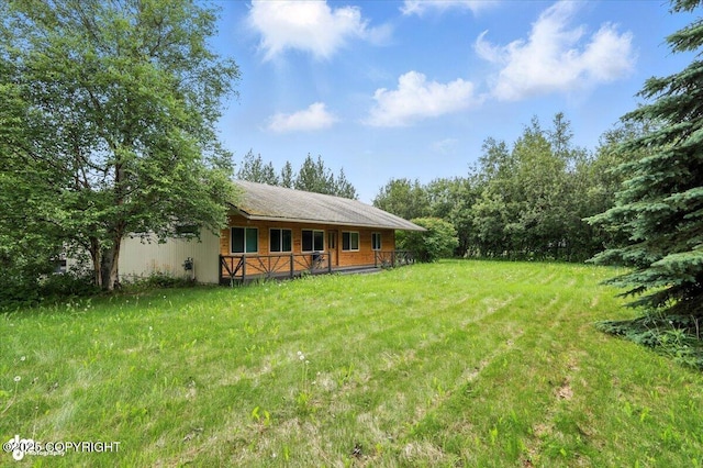 1447 N Ranch Rd, Palmer, AK 99645 - view of grassy yard featuring a porch