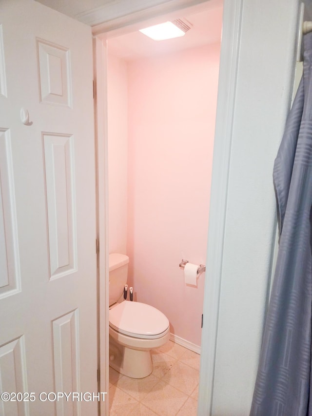 1447 N Ranch Rd, Palmer, AK 99645 - bathroom featuring toilet and baseboards