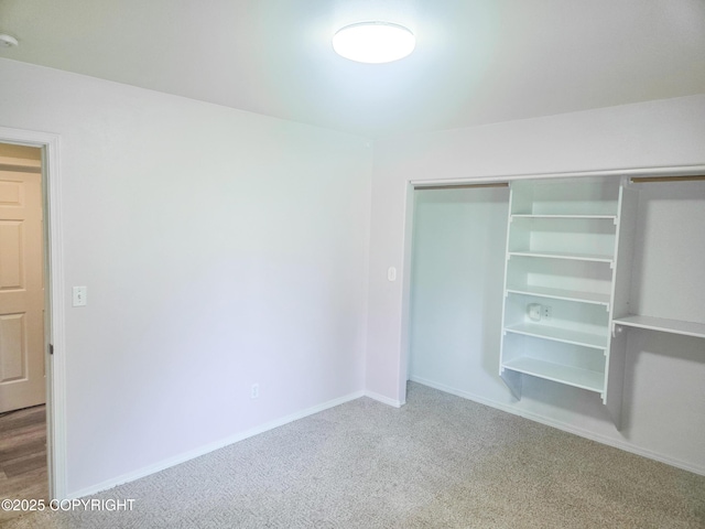1447 N Ranch Rd, Palmer, AK 99645 - unfurnished bedroom featuring a closet and carpet flooring