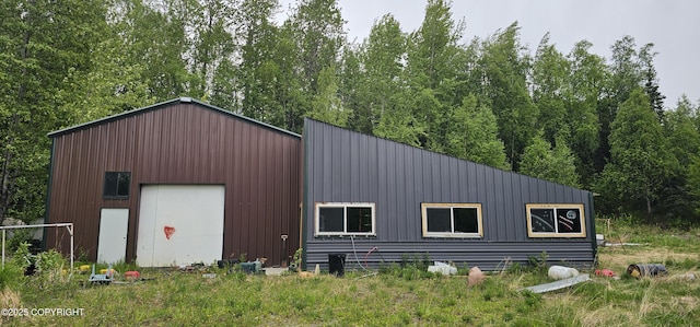 2514 E Sleepy Hollow Cir, Wasilla, AK 99654 - view of property exterior featuring a detached garage and an outdoor structure