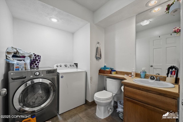 5320 Larkspur St, Anchorage, AK 99507 - laundry room featuring separate washer and dryer