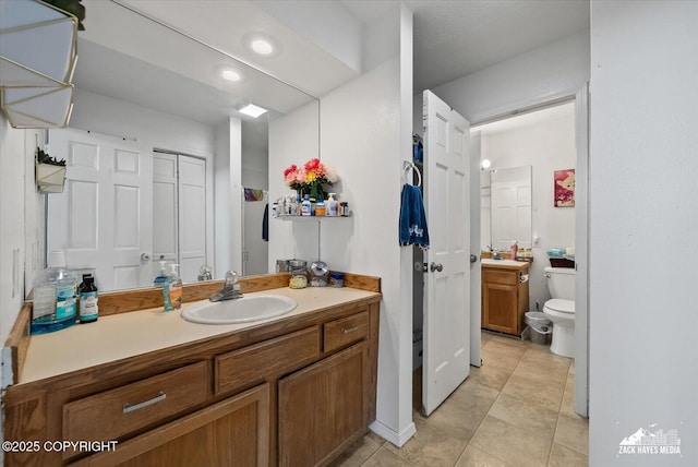 5320 Larkspur St, Anchorage, AK 99507 - bathroom with vanity, tile patterned flooring, and recessed lighting