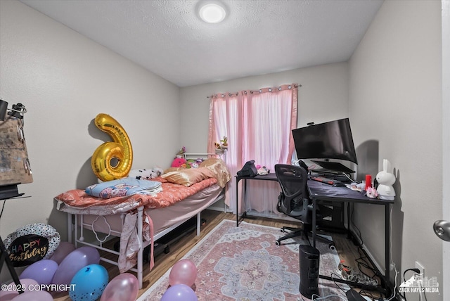 5320 Larkspur St, Anchorage, AK 99507 - bedroom featuring wood finished floors and an office area