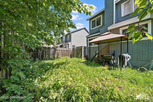 5320 Larkspur St, Anchorage, AK 99507 - fenced backyard featuring a gazebo