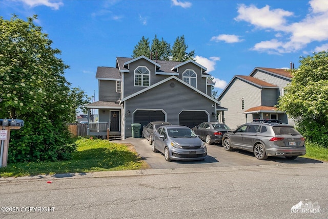 5320 Larkspur St, Anchorage, AK 99507 - view of front of home with asphalt driveway, roof with shingles, and a garage