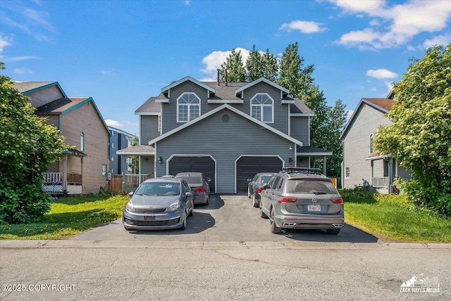 5320 Larkspur St, Anchorage, AK 99507 - view of front of home featuring driveway, an attached garage, and a shingled roof