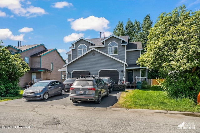 5320 Larkspur St, Anchorage, AK 99507 - view of front of property featuring driveway, roof with shingles, an attached garage, and a front lawn