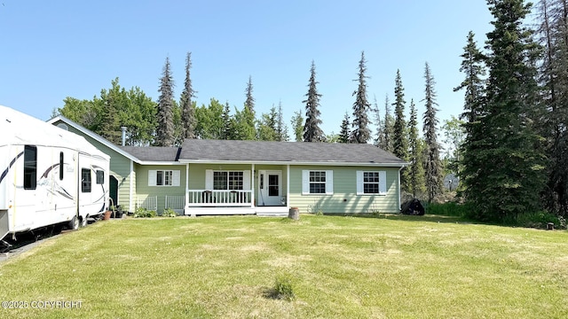 130 Amaryllis St, Soldotna, AK 99669 - view of front of house featuring covered porch and a front lawn