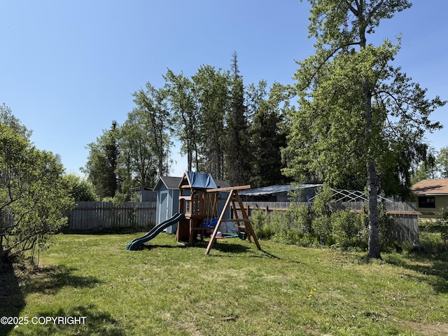 711 Maple Dr, Kenai, AK 99611 - fenced backyard featuring a playground
