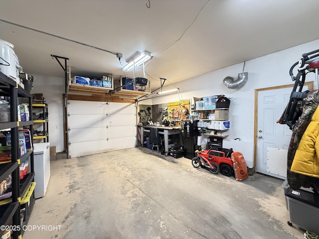 711 Maple Dr, Kenai, AK 99611 - garage with washer / clothes dryer and a garage door opener