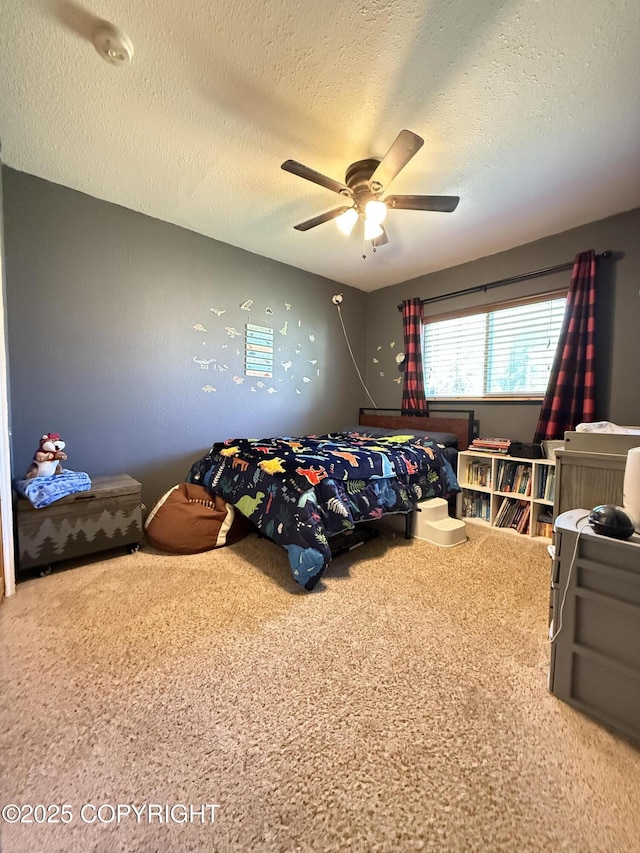 711 Maple Dr, Kenai, AK 99611 - carpeted bedroom featuring a textured ceiling and ceiling fan