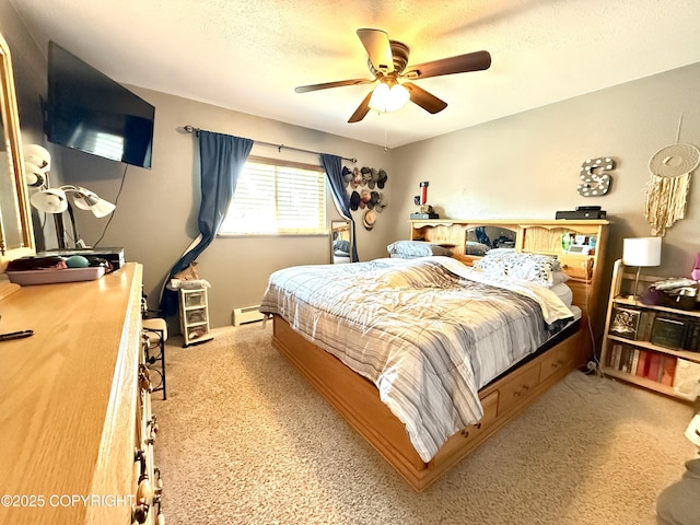 711 Maple Dr, Kenai, AK 99611 - bedroom with baseboard heating, light colored carpet, a ceiling fan, and a textured ceiling