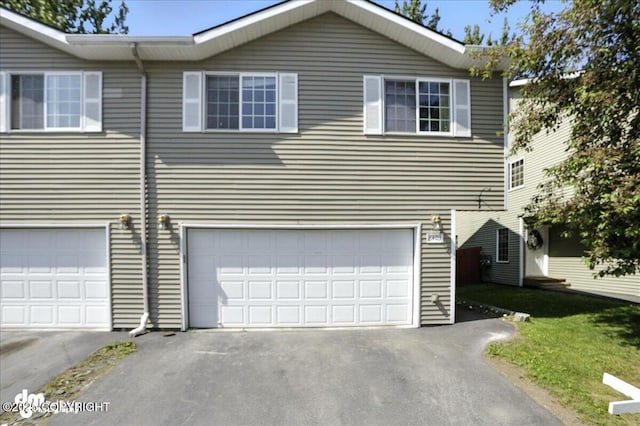 6403 E 10th Ave # 26, Anchorage, AK 99504 - view of front of property with a garage and driveway