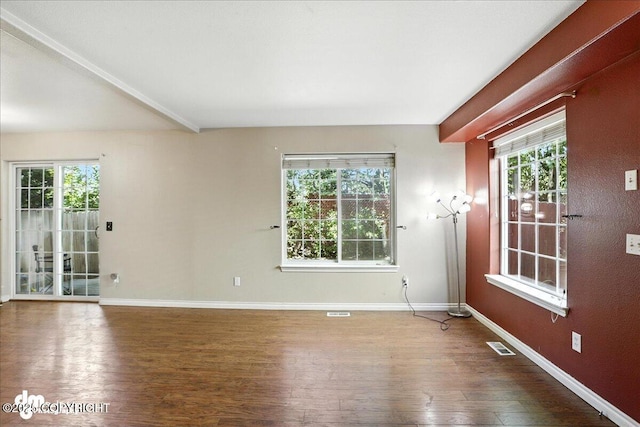 6403 E 10th Ave # 26, Anchorage, AK 99504 - unfurnished room with wood finished floors and plenty of natural light