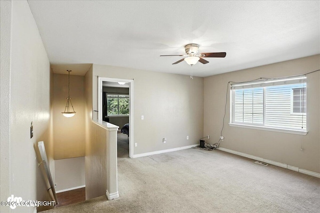 6403 E 10th Ave # 26, Anchorage, AK 99504 - carpeted spare room with a ceiling fan and baseboards
